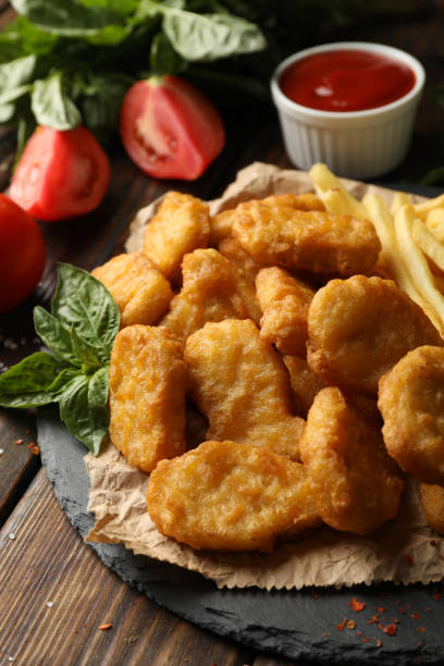 istock Composition with chicken nuggets, sauces and potato on wooden background 1265036553