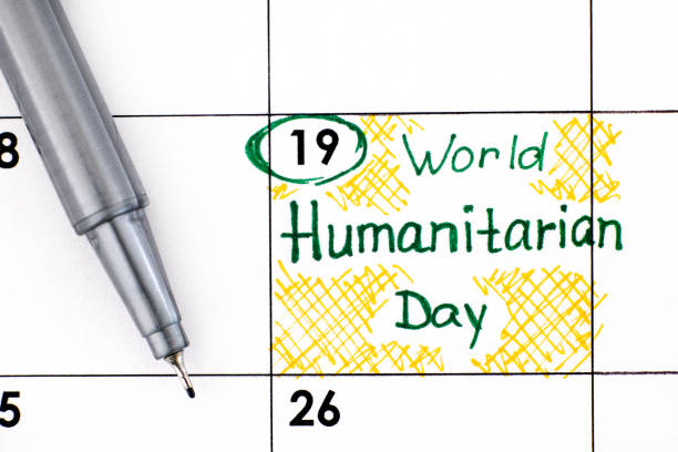 istock Reminder World Humanitarian Day in calendar with pen. 1265036712