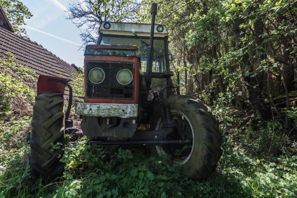 istock red old tractor on a farm 1265036933