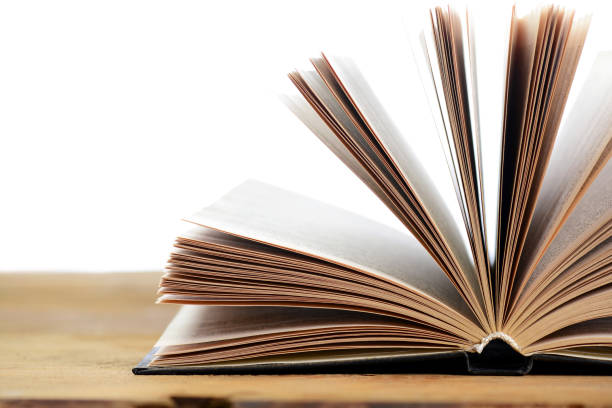 istock old book on a wooden table 1265038682