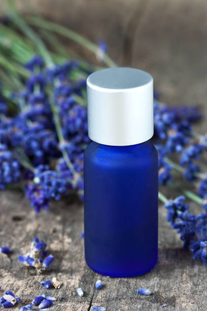 istock Spa composition with aroma oil and lavender flowers 1265038858