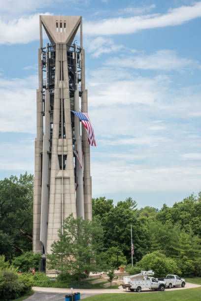 Millenium Carillon: Flag Display Naperville, Il,United States-April 24,2014: American flag displayed on the Millennium Carillon tower in downtown Naperville. carillon stock pictures, royalty-free photos & images