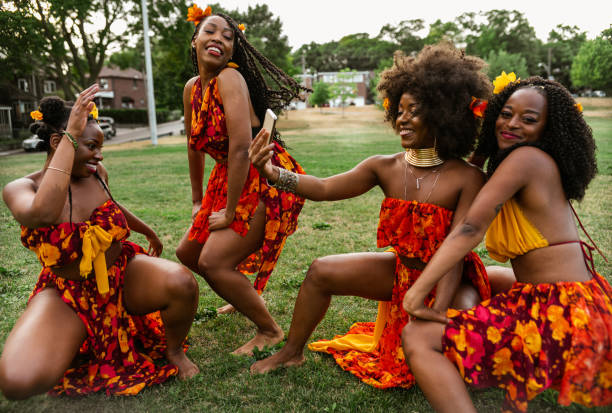 istock Young black women dancing in the field 1265039527