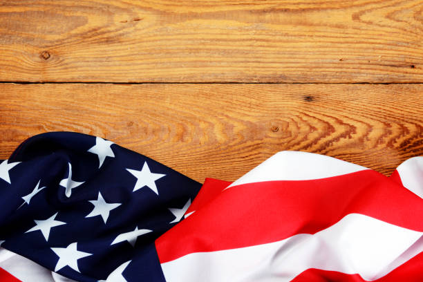 istock American flag on wooden background 1265040207
