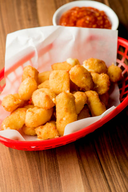 istock Mozzarella sticks. Cheese sticks. Classic American appetizer favorite. Fried cheese with cheddar cheese dipped in beer battered, tempura flakes, deep fried and served with spicy marinara dipping sauce. 1265040464