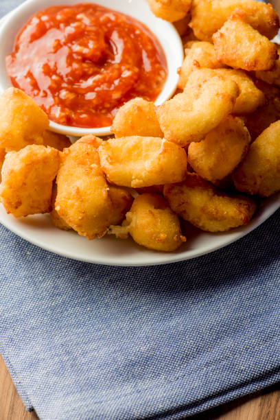 istock Mozzarella sticks. Cheese sticks. Classic American appetizer favorite. Fried cheese with cheddar cheese dipped in beer battered, tempura flakes, deep fried and served with spicy marinara dipping sauce. 1265040481