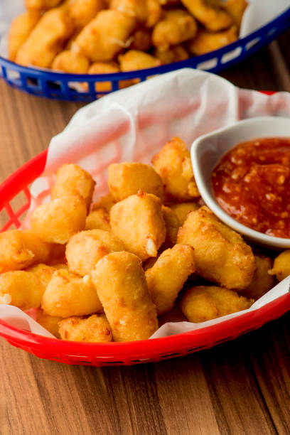 istock Mozzarella sticks. Cheese sticks. Classic American appetizer favorite. Fried cheese with cheddar cheese dipped in beer battered, tempura flakes, deep fried and served with spicy marinara dipping sauce. 1265040486