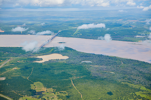 Orinoquia bridge over Orinoco river. Puerto Ordaz, Venezuela. The Orinoco is the second river in South America following the Amazon River in Brazil. It is one of the longest rivers with 2,140 km and its drainage basin covers 880,000 square kilometres. The Orinoco and all its tributaries are the main transport system for eastern and interior Venezuela and the llanos of Colombia.