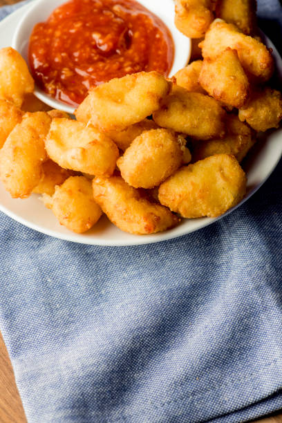 istock Mozzarella sticks. Cheese sticks. Classic American appetizer favorite. Fried cheese with cheddar cheese dipped in beer battered, tempura flakes, deep fried and served with spicy marinara dipping sauce. 1265040668