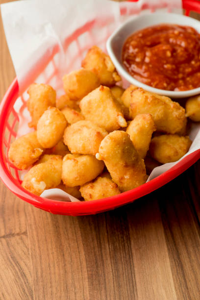 istock Mozzarella sticks. Cheese sticks. Classic American appetizer favorite. Fried cheese with cheddar cheese dipped in beer battered, tempura flakes, deep fried and served with spicy marinara dipping sauce. 1265040669