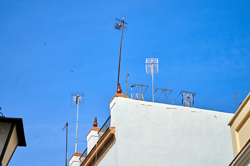 Telecommunications antennas on top of houses. Seville Spain