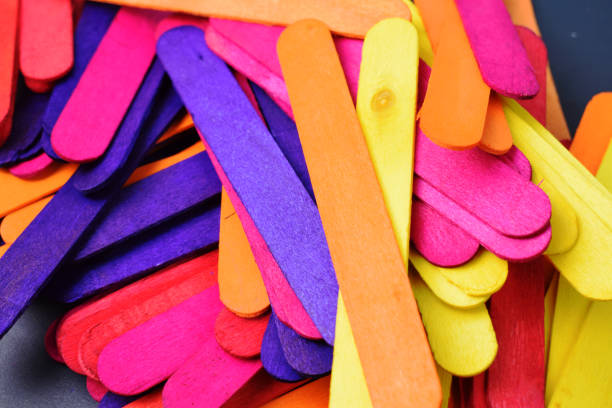 istock Closeup view of Colourful Ice cream sticks making background 1265042057