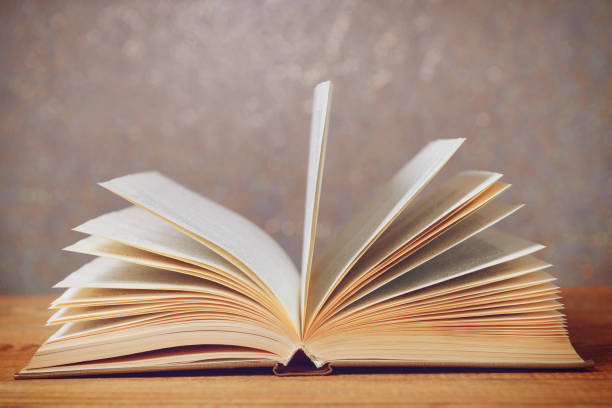 istock old book on a wooden table 1265042400