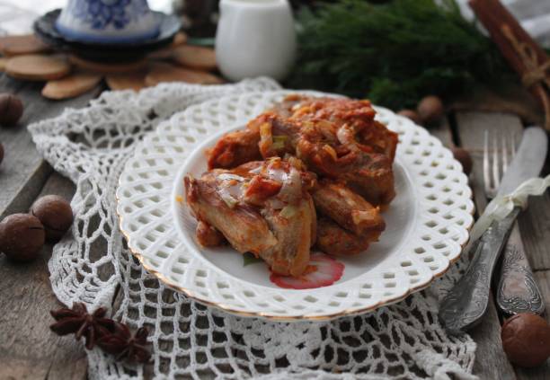 istock stewed ribs in tomato with onion 1265043586