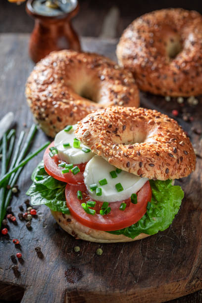 istock Tasty bagel with tomatoes, mozzarella and lettuce 1265043654