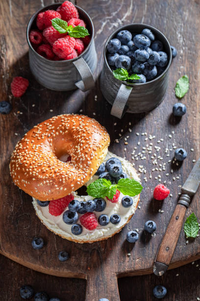 istock Tasty bagel with raspberries and blueberries for quick lunch 1265044308