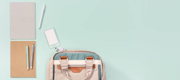 istock School backpack and school supplies, notebooks, pens, schoolboy badge 1265044546