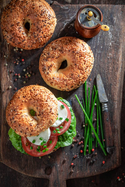 istock Homemade bagel with mozzarella, tomatoes and lettuce 1265044579
