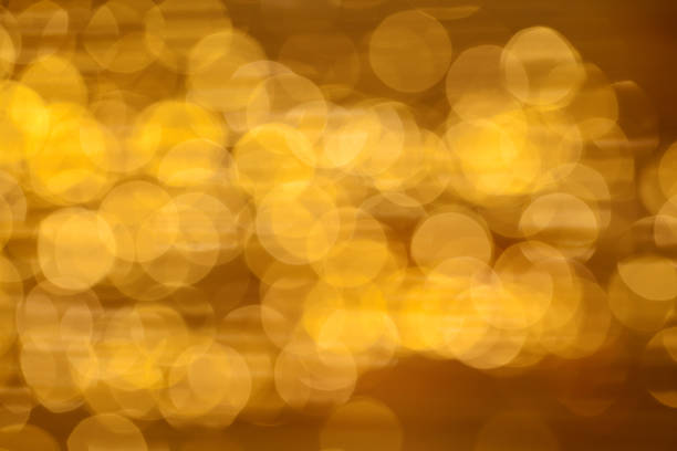 istock Golden background with abstract bokeh lights 1265046174