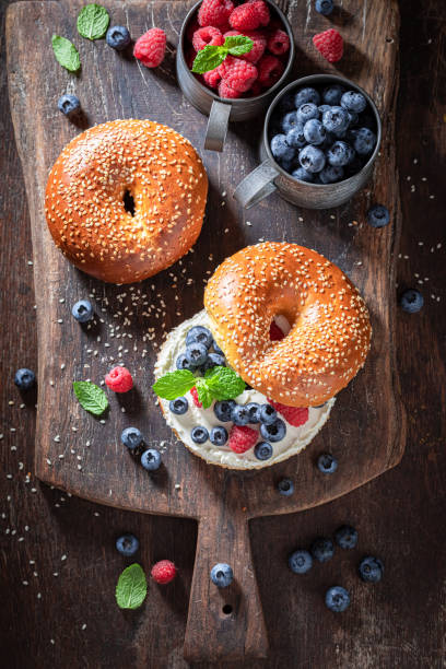 istock Homemade bagel with raspberries and blueberries for quick lunch 1265046335