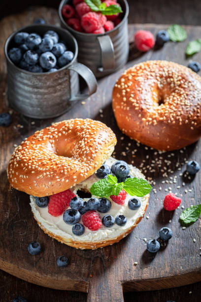 istock Delicious bagel with raspberries and blueberries for quick lunch 1265046463