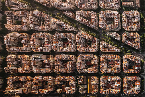 Aerial view of typical buildings of Barcelona cityscape from helicopter. top view, Eixample residencial famous urban grid