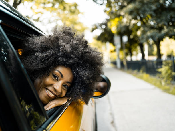 istock Young black woman inside the car 1265049573