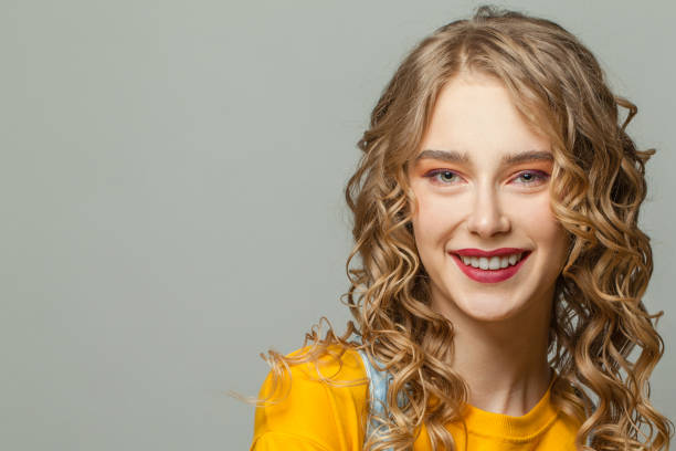 istock Happy woman smiling, face close up 1265050235