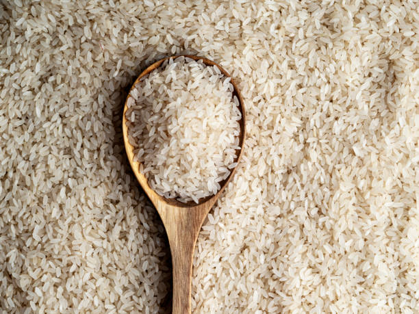 istock Rice grains, Basmati rice, Rice with a spoon,  Uncooked white rice background, 1265051211