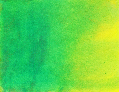 Hand painted watercolor background with shades of green and yellow. There is a color gradient through the painting.