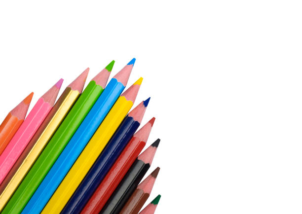 istock Arrow pattern made with some different wood pencil crayons on white paper background 1265052052