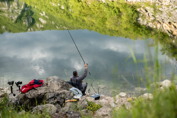 istock Fishermen by the fresh water 1265052179