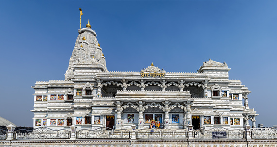 Name plate on front indicates the name of the temple in local language 'Hindi'. Prem Mandir meaning temple of divine love is a Hindu temple in Vrindavan, Mathura, India. It is maintained by Jagadguru Kripalu Parishat, an international non-profit, educational, spiritual, charitable trust. The complex is on a 55-acre site on the outskirts of Vrindavan, and is dedicated to Lord Radha Krishna and Sita Ram, Radha Krishna on the first level and Sita Ram on the second level.