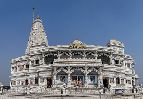 Name plate on front indicates the name of the temple in local language 'Hindi'. Prem Mandir meaning temple of divine love is a Hindu temple in Vrindavan, Mathura, India. It is maintained by Jagadguru Kripalu Parishat, an international non-profit, educational, spiritual, charitable trust. The complex is on a 55-acre site on the outskirts of Vrindavan, and is dedicated to Lord Radha Krishna and Sita Ram, Radha Krishna on the first level and Sita Ram on the second level.