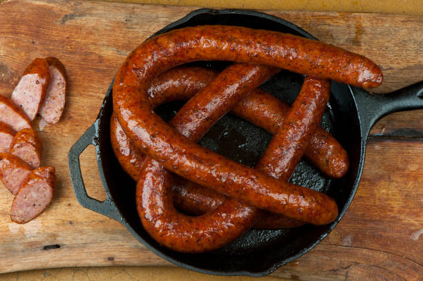 istock Pork sausage BBQ. Barbecue table spread. Beef brisket, chicken, pork ribs, beef ribs, Mac n cheese, cornbread, Brussels sprouts, coleslaw & beer. Classic traditional Texas meats & side dishes. 1265054007