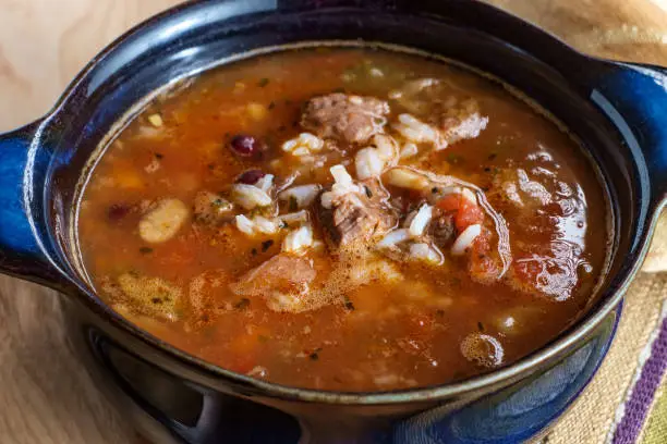 Slow cooker beef and vegetables soup with kidney beans and rice