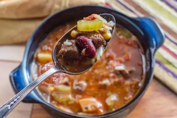 Slow cooker beef and vegetables soup with kidney beans and rice