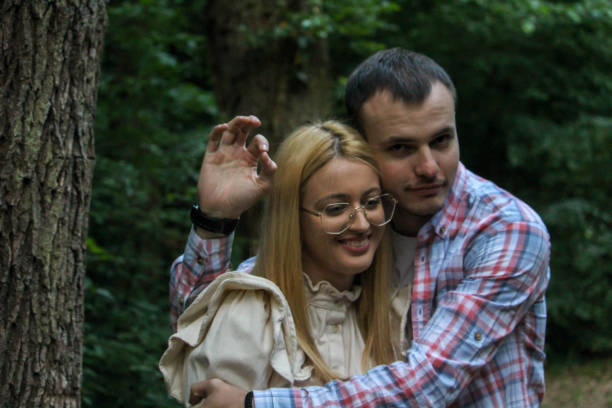 istock Young couple having fun in forest 1265055076