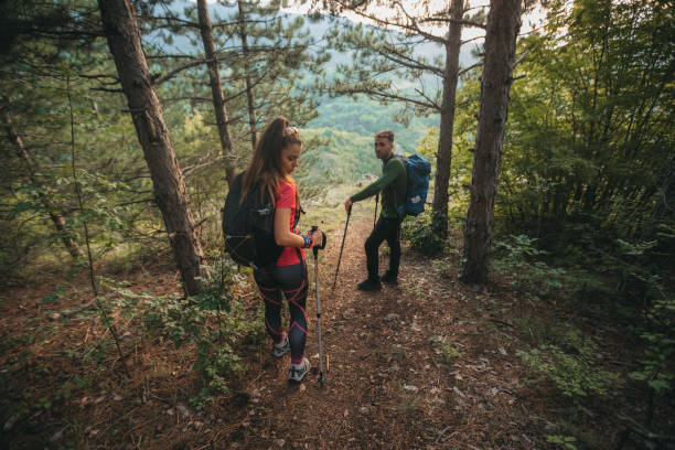 istock Young couple hiking in nature 1265055845