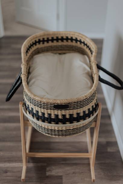 Baby Moses Basket Beautiful Moses Basket with Newborn baby. moses basket stock pictures, royalty-free photos & images