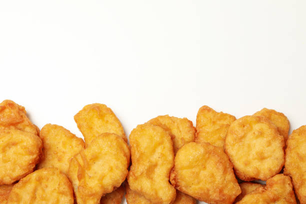 istock Fried chicken nuggets on white background, top view 1265061964