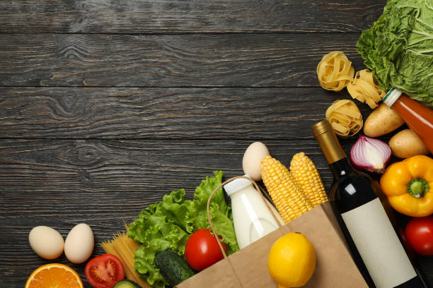 istock Different food on wooden background, space for text 1265063423