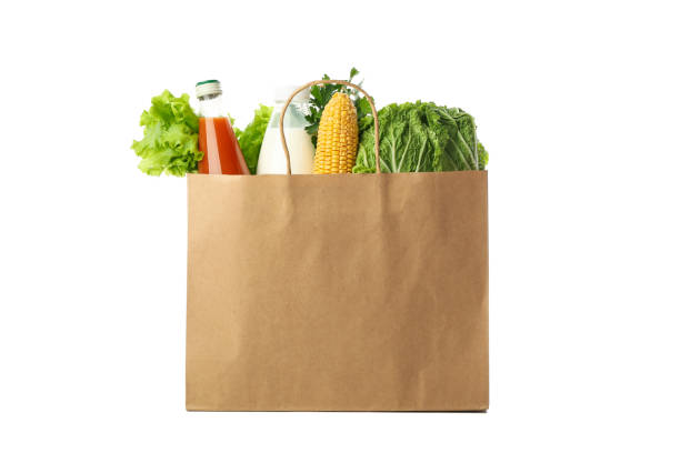 istock Paper bag with different food isolated on white background 1265063947