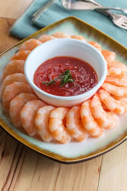 Delightful tail-on shrimp cocktail served with horseradish dipping sauce