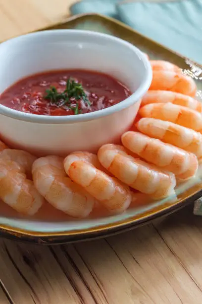 Delightful tail-on shrimp cocktail served with horseradish dipping sauce