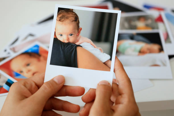 istock Hand holding instant photo 1265066297