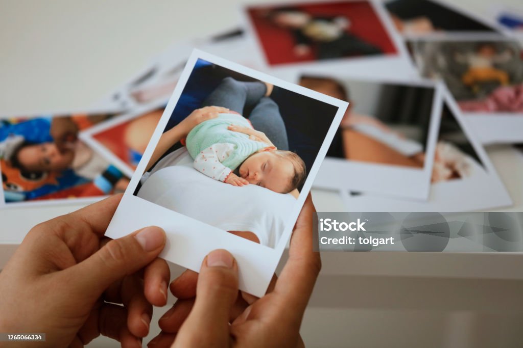 Hand holding instant photo Photograph Stock Photo