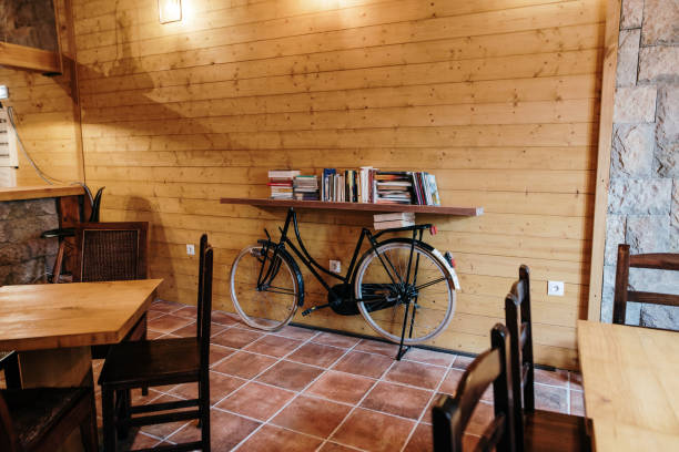 istock Decoration ideas - Bicycle holding a shelf with books in a cafeteria 1265066516