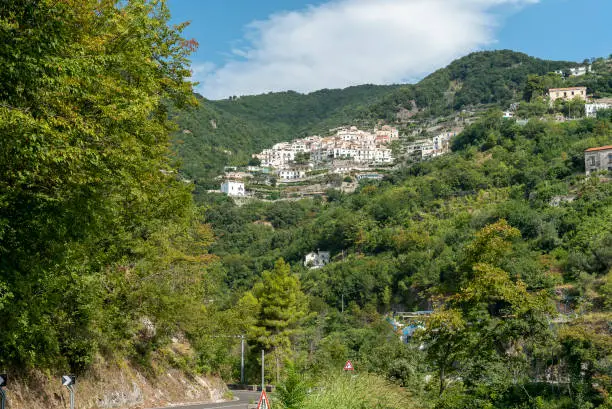 View of the inhabited area of Albori, a small village of Vietri sul Mare, seen from the Amalfi coast. View of the houses climbing the hill.