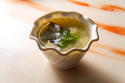 Japanese miso soup bowl with soft tofu and seaweed